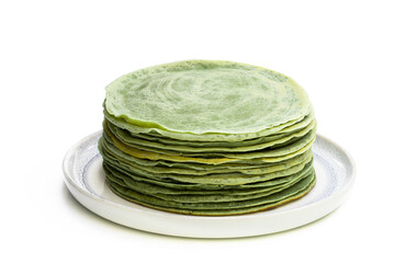 Green pancakes isolated on white