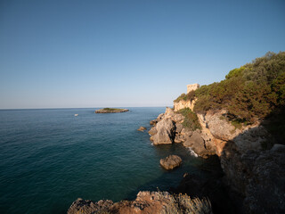 Fototapeta na wymiar coastal tower and islet on the Tyrrhenian Sea near Marina di Camerota. Cilento, Salerno, Campania, Italy