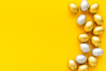 Silver and golden Easter eggs. Easter decoration, top view