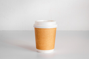 Take out coffee paper cup on the table. Close up