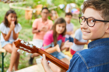 Boy with guitar performing on talent show