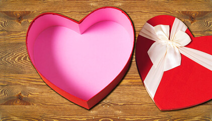 open heart shaped box on wooden table