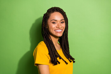 Portrait of pretty fashionable cheerful brown-haired girl wearing small braids isolated over bright...
