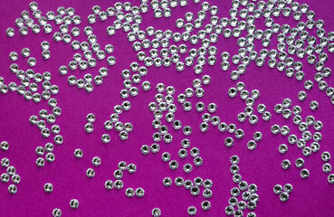 rhinestones on a purple background, top photo