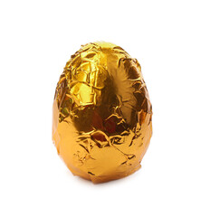 Chocolate egg wrapped in golden foil isolated on white