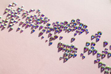 rhinestones on a pink background, blure. design for text