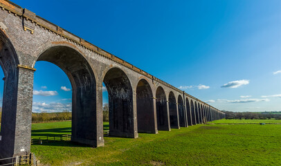 Fototapeta premium A view of the largest brick viaduct in the UK, the Welland Valley viaduct on a bright sunny spring day