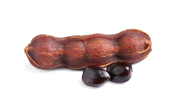 Ripe peeled tamarind and seeds on white background. Exotic fruit