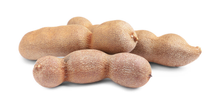 Delicious ripe tamarinds on white background. Exotic fruit