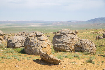 Concretions in Torysh, Western Kazakhstan. Concretion is a spherical mineral aggregate of dense cryptocrystalline, granular or radial-radial structure.