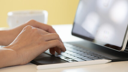 person typing on a laptop computer