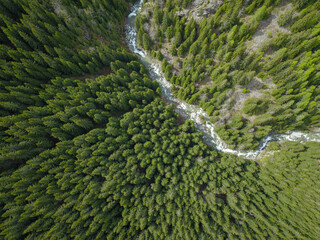 Aerial drone view above Latorita valley and its canyon, flowing along the craggy mountains and...
