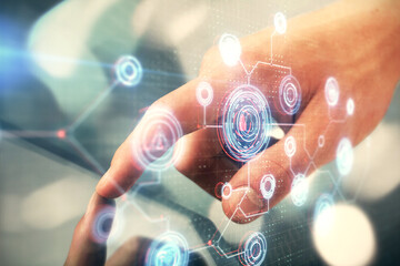 Multi exposure of man's hand holding and using a digital device and data theme drawing. Innovation...