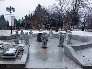 Ancient buildings and stone carvings of Jingfu palace in Seoul, South Korea on a snowy day