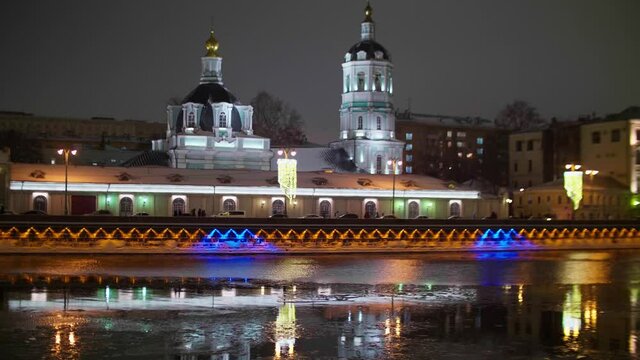 Embakment of river in the centre of Moscow at New years night. Bright colours and lights of a big city.
