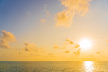Fototapeta na wymiar Beautiful tropical beach sea ocean with cloud and sky at sunset or sunrise time