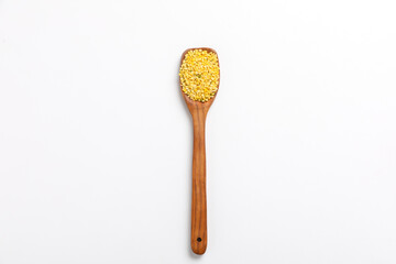 yellow moong mung dal lentil pulse bean on white background.