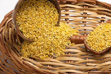 yellow moong mung dal lentil pulse bean in a bowl on wooden background.