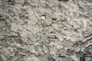 concrete wall with rough smears of cement gray background