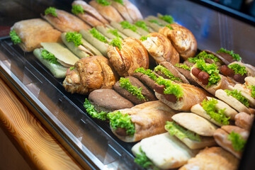 Burgers, sandwich and hotdogs on showcase