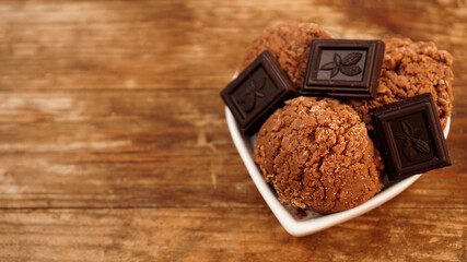 Homemade chocolate ice cream with chocolate pieces in a white bowl