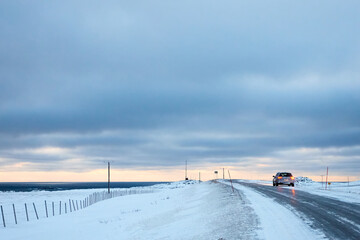 driving on road in the country side in winter