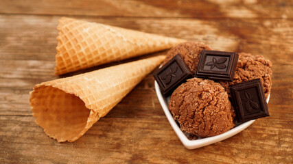Homemade chocolate ice cream with chocolate pieces in a white bowl