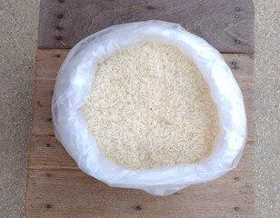 Two kilograms of rice in a plastic bag.