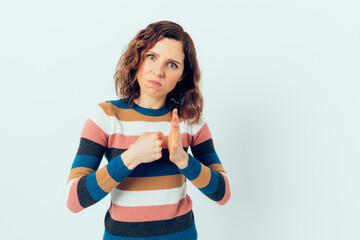 Young woman expresses aggression showing fist