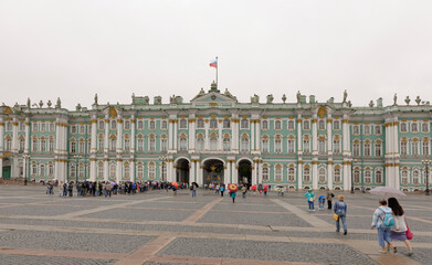 Tourists at the Palace Square in the rain