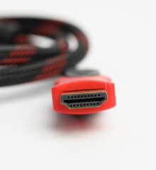twisted cable in a textile black sheath on a white background, hdmi adapter