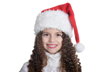 Portrait of smiling little girl in Santa hat