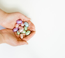 chocolate eggs in female hands