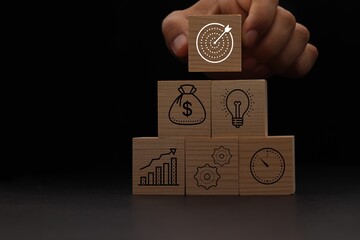 Concept of business strategy and action plan. Wood cube block stacking with icon