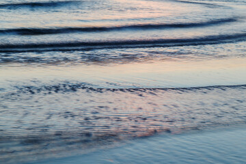 Vivid lights of the sea sunset with long exposure effect