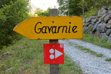 Hiking indication panel in the French Pyrenees towards the "Cirque de Gavarnie"