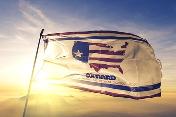 Oxnard of California of United States flag waving on the top