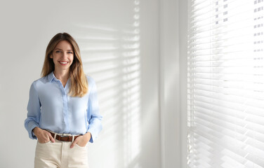 Portrait of beautiful young businesswoman in office