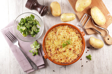 homemade potato gratin with lettuce