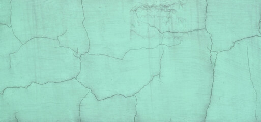 Old wall in cracks green mint color basis texture