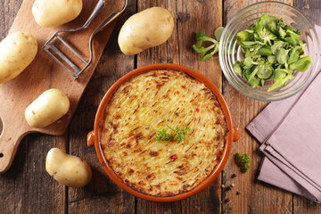 homemade potato gratin with lettuce