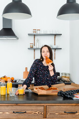 woman eating pizza