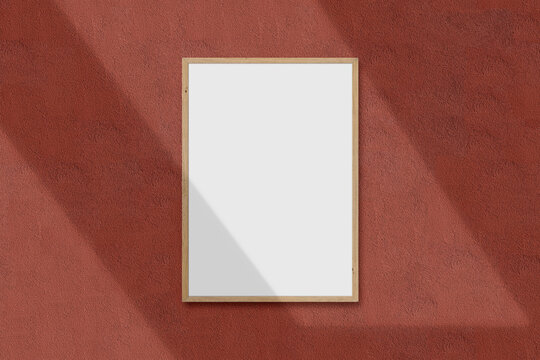 A4 vertical blank picture wood frame for photographs, art, graphics with Tree branch shadow overlay. Isolated frame template on the background texture. Template with clipping path.3D Rendering