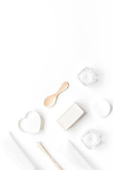 white cosmetic set on desk background top view mock up