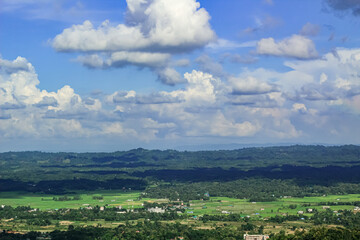 Fototapeta na wymiar top view of khagrachari town full of cloud shadow in hill and green