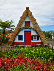Fototapeta na wymiar Traditional Madeira building with thatched roof.