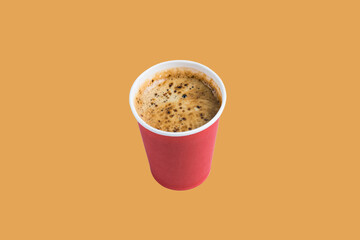 Coffee in red paper cup on terracotta background copy space