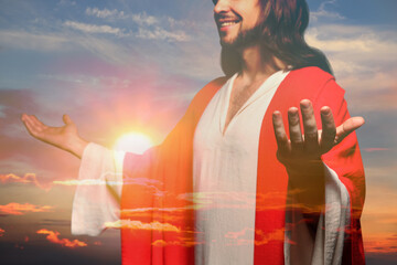 Jesus Christ reaching out his hands and praying at sunset, double exposure
