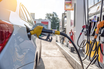 Pumping gasoline fuel in car at gas station.concept Travel and transportation.