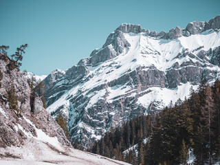 Beautiful snow covered winter alpine scenery. Snow and ice on the high glacier ridges of the Swiss Alps. rock formations and glacier ridges.